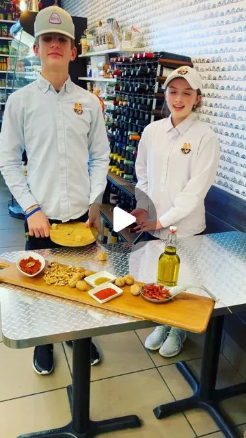 Bô Café staff presenting a Mediterranean food spread